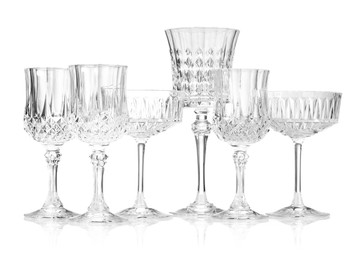 Photo of Different empty clean glasses isolated on white