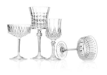 Photo of Different empty clean glasses isolated on white