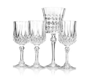 Photo of Different empty clean glasses isolated on white