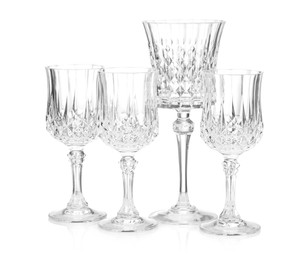 Photo of Different empty clean glasses isolated on white