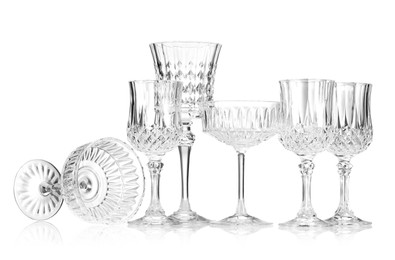 Photo of Different empty clean glasses isolated on white