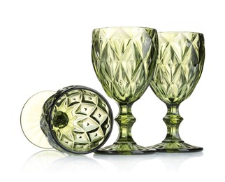 Photo of Three empty clean glasses isolated on white