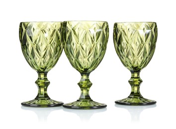 Photo of Three empty clean glasses isolated on white