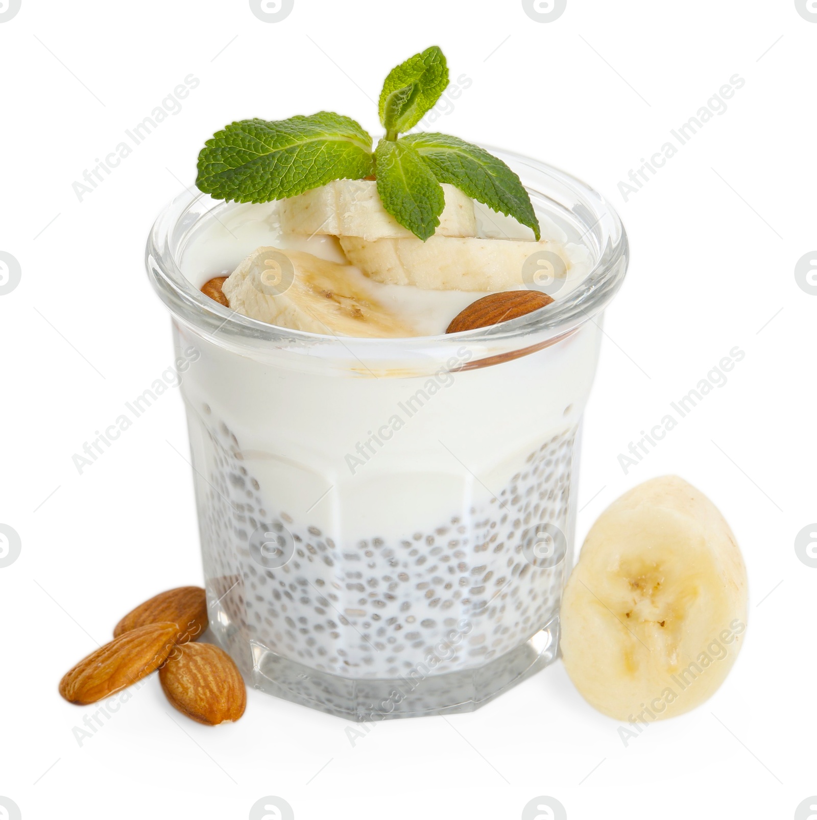 Delicious dessert with chia seeds, yogurt, banana, almond and mint in glass on white background. Superfood Photo of Delicious dessert with chia seeds, yogurt, banana, almond and mint in glass on white background. Superfood