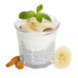 Photo of Delicious dessert with chia seeds, yogurt, banana, almond and mint in glass on white background. Superfood
