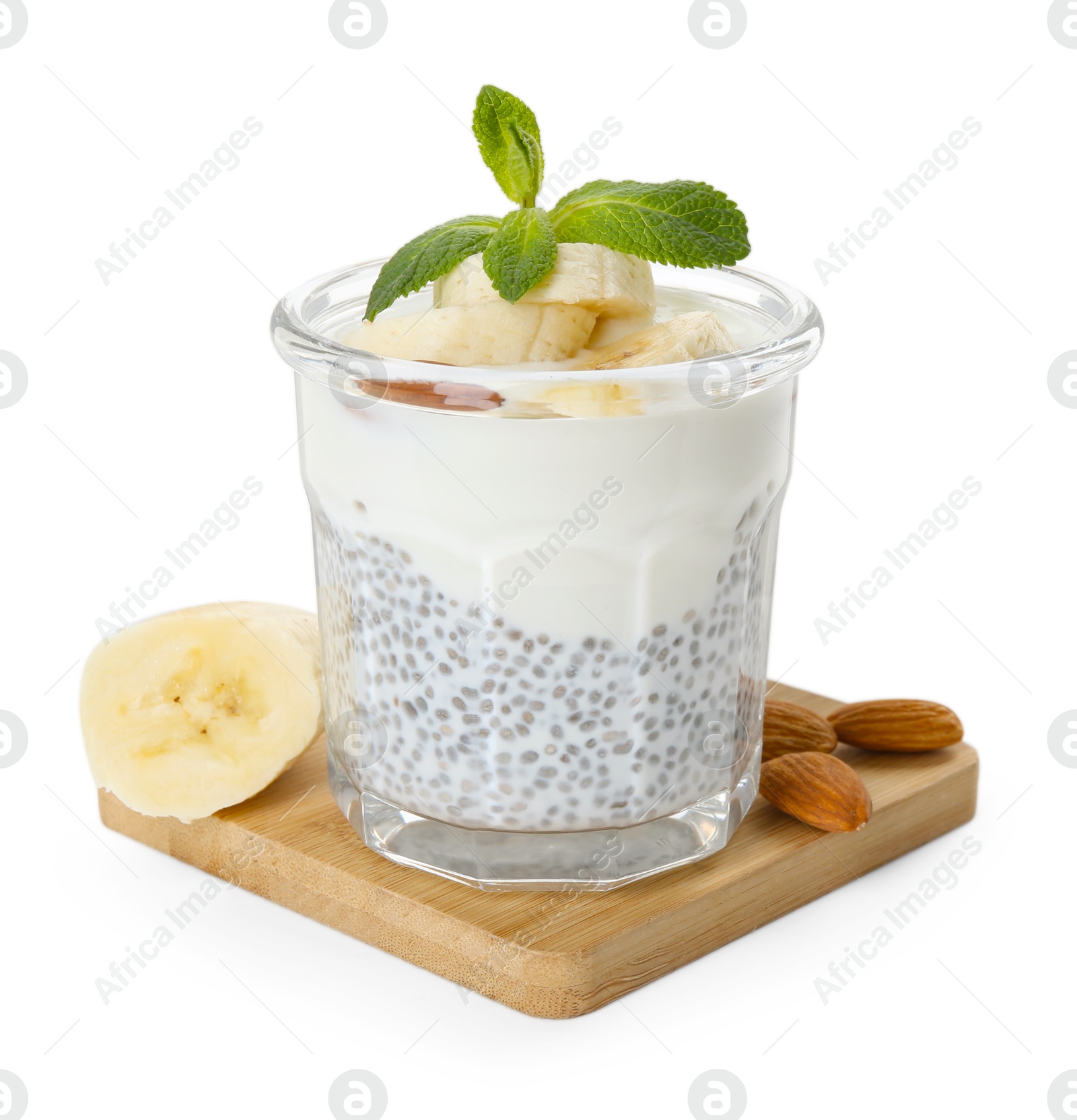 Delicious dessert with chia seeds, yogurt, banana, almond and mint in glass on white background. Superfood Photo of Delicious dessert with chia seeds, yogurt, banana, almond and mint in glass on white background. Superfood