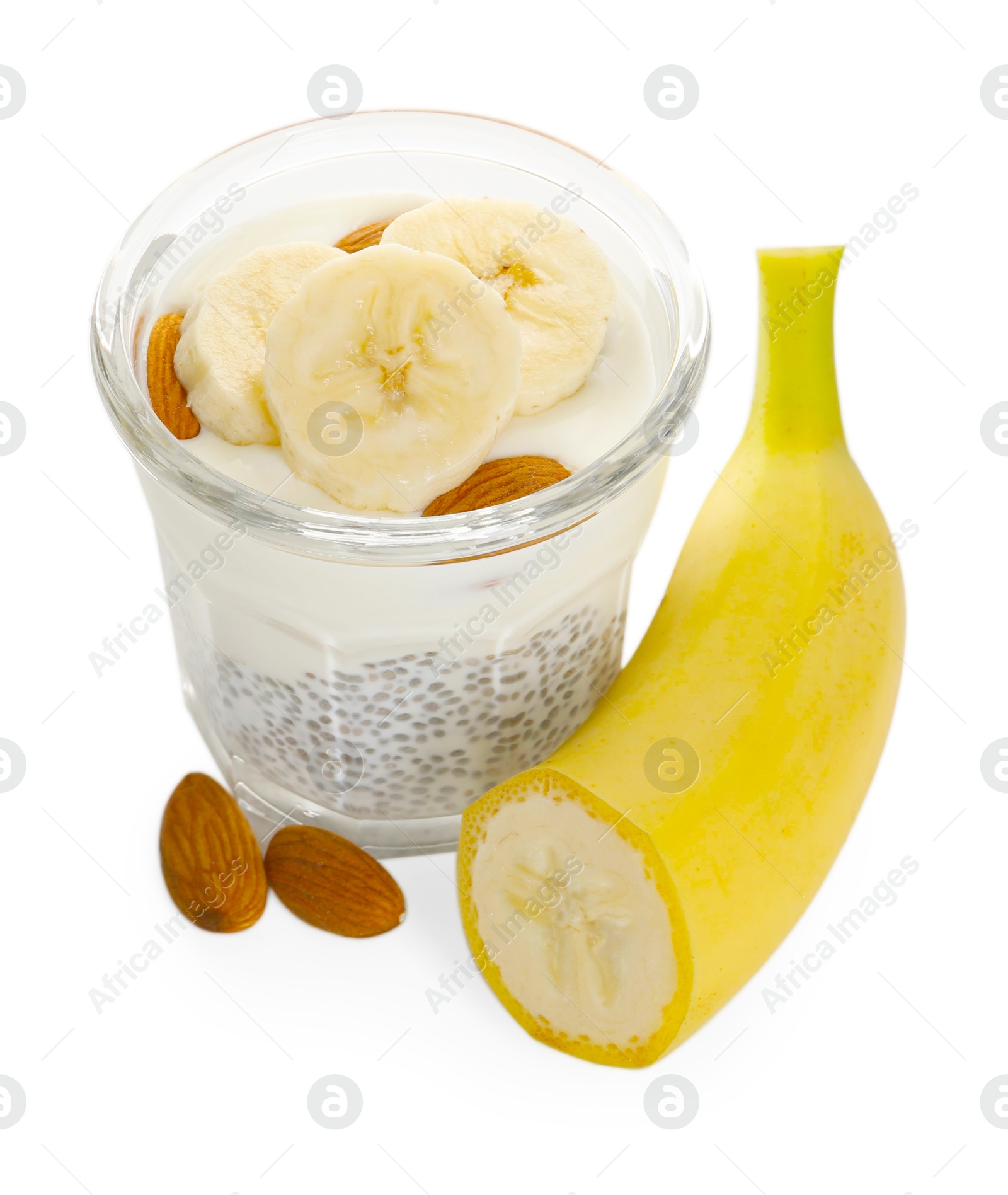 Delicious dessert with chia seeds, yogurt, banana and almond in glass on white background. Superfood Photo of Delicious dessert with chia seeds, yogurt, banana and almond in glass on white background. Superfood