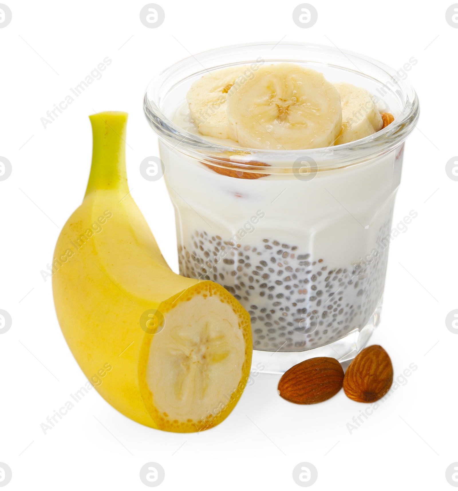 Delicious dessert with chia seeds, yogurt, banana and almond in glass on white background. Superfood Photo of Delicious dessert with chia seeds, yogurt, banana and almond in glass on white background. Superfood
