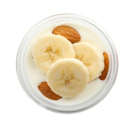 Photo of Delicious dessert with yogurt, banana and almond in glass on white background, top view. Superfood
