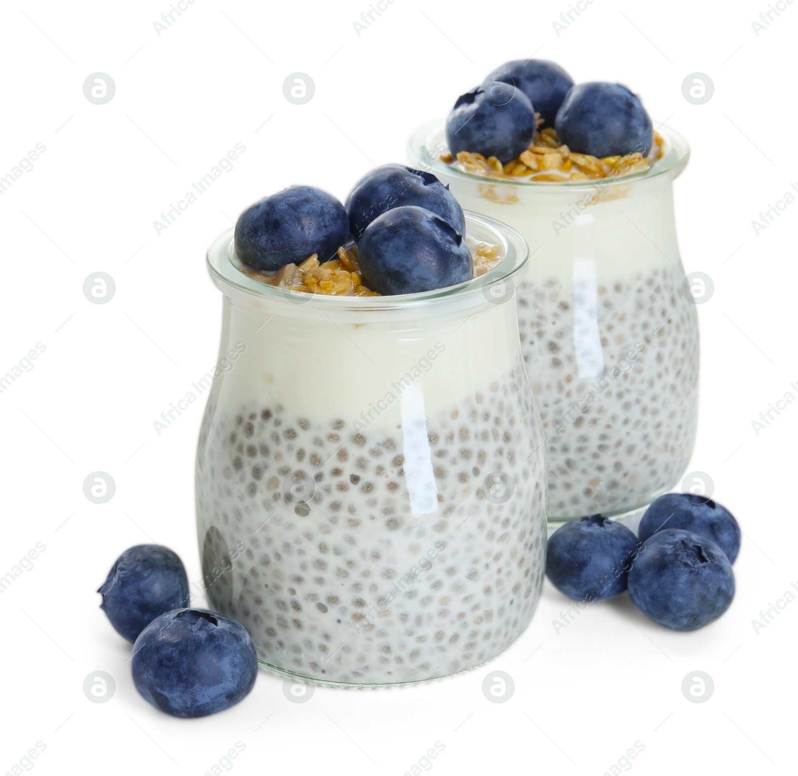 Delicious pudding with chia seeds, yogurt, blueberries and granola in glasses isolated on white. Superfood Photo of Delicious pudding with chia seeds, yogurt, blueberries and granola in glasses isolated on white. Superfood