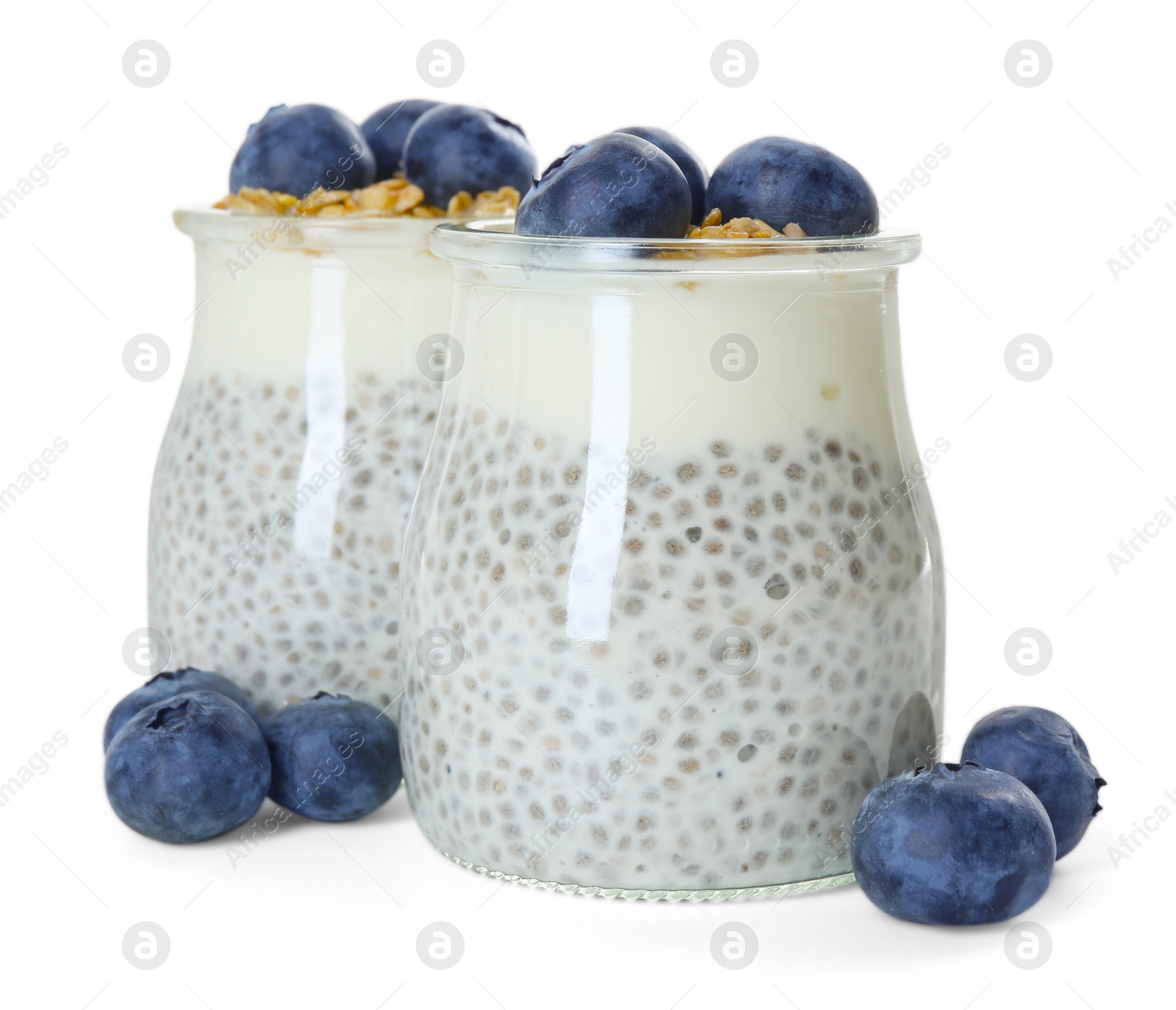Delicious pudding with chia seeds, yogurt, blueberries and granola in glasses isolated on white. Superfood Photo of Delicious pudding with chia seeds, yogurt, blueberries and granola in glasses isolated on white. Superfood