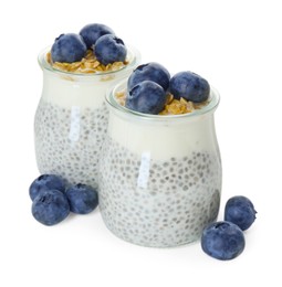 Photo of Delicious pudding with chia seeds, yogurt, blueberries and granola in glasses isolated on white. Superfood