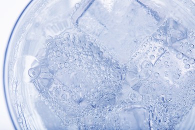 Image of Top view of soda water with ice in glass