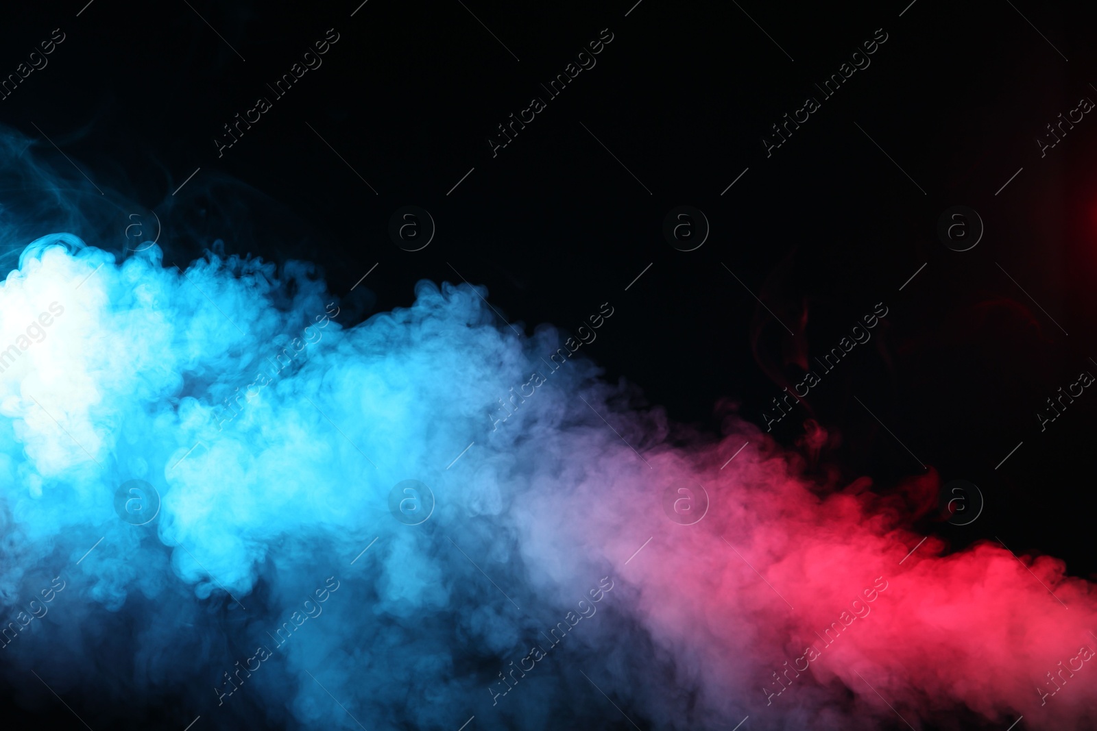 Beautiful smoke in neon lights on dark background. Space for text Photo of Beautiful smoke in neon lights on dark background. Space for text