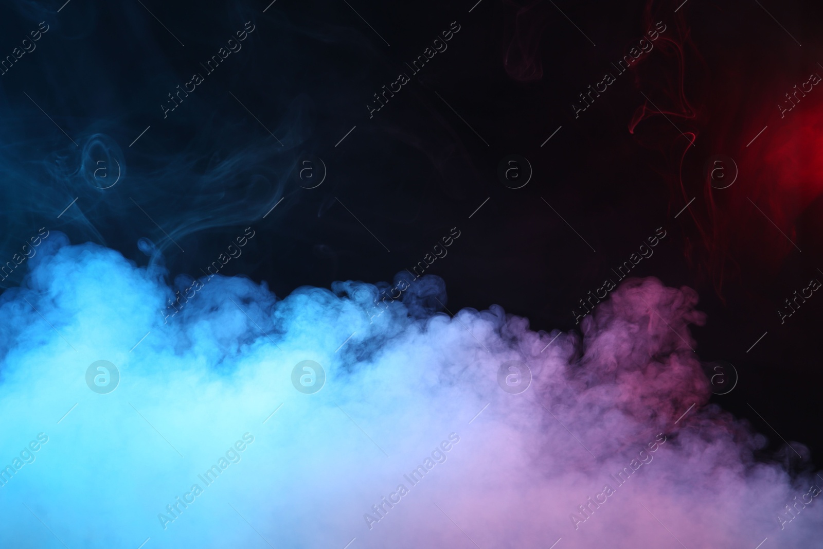 Beautiful smoke in neon lights on dark background. Space for text Photo of Beautiful smoke in neon lights on dark background. Space for text