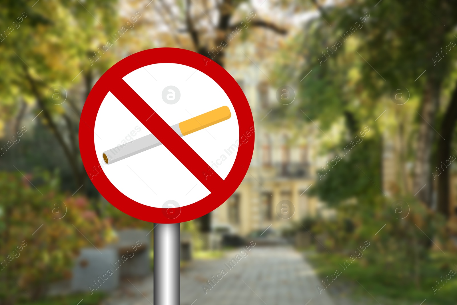 No Smoking sign on city street. Space for text Image of No Smoking sign on city street. Space for text