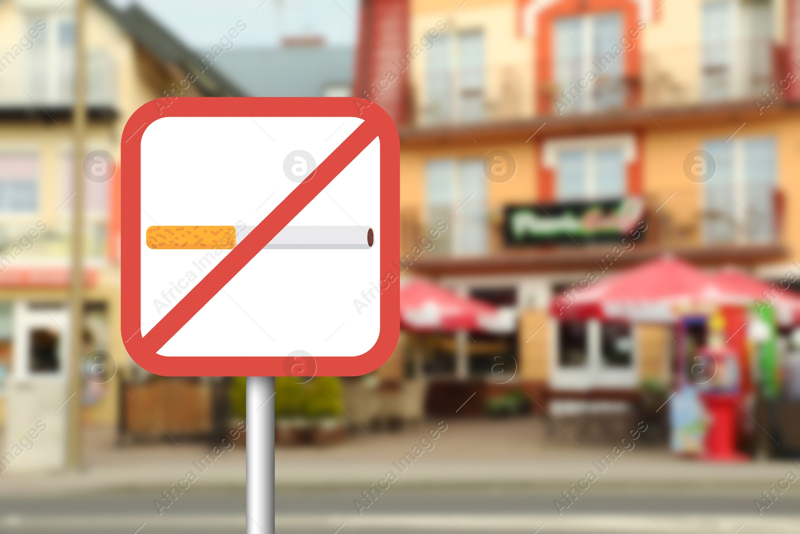 No Smoking sign on city street. Space for text Image of No Smoking sign on city street. Space for text