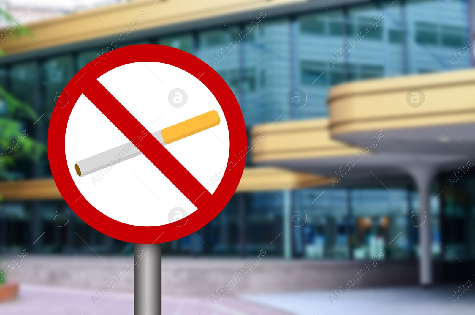 No Smoking sign on city street. Space for text Image of No Smoking sign on city street. Space for text