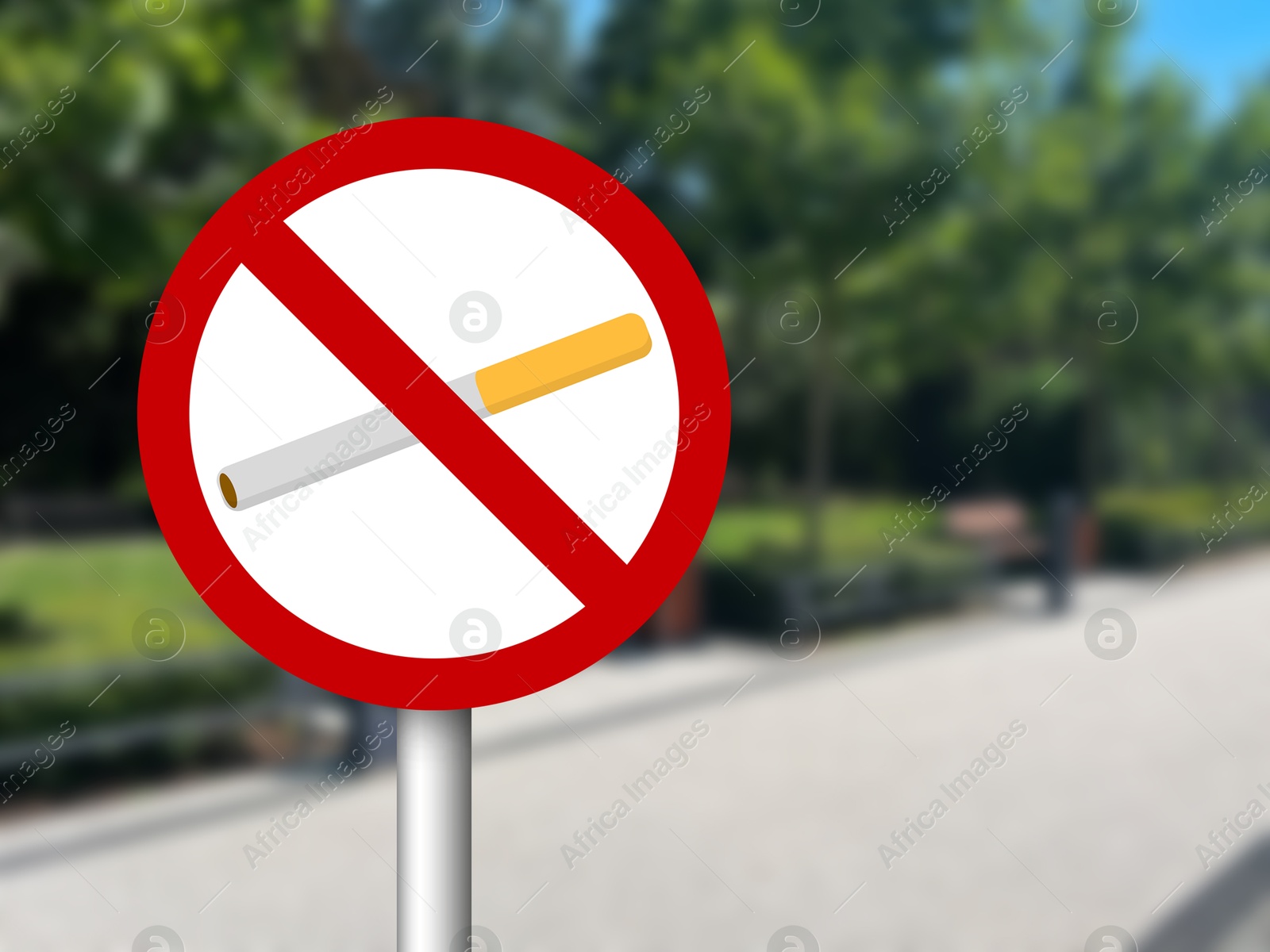 No Smoking sign on city street. Space for text Image of No Smoking sign on city street. Space for text