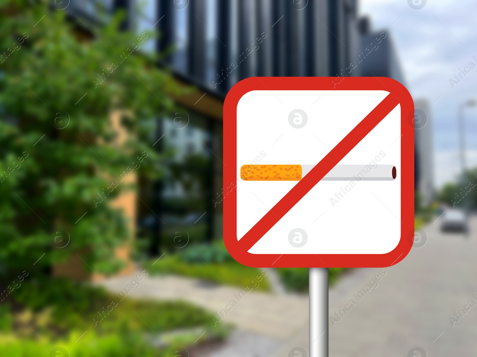 No Smoking sign on city street. Space for text Image of No Smoking sign on city street. Space for text