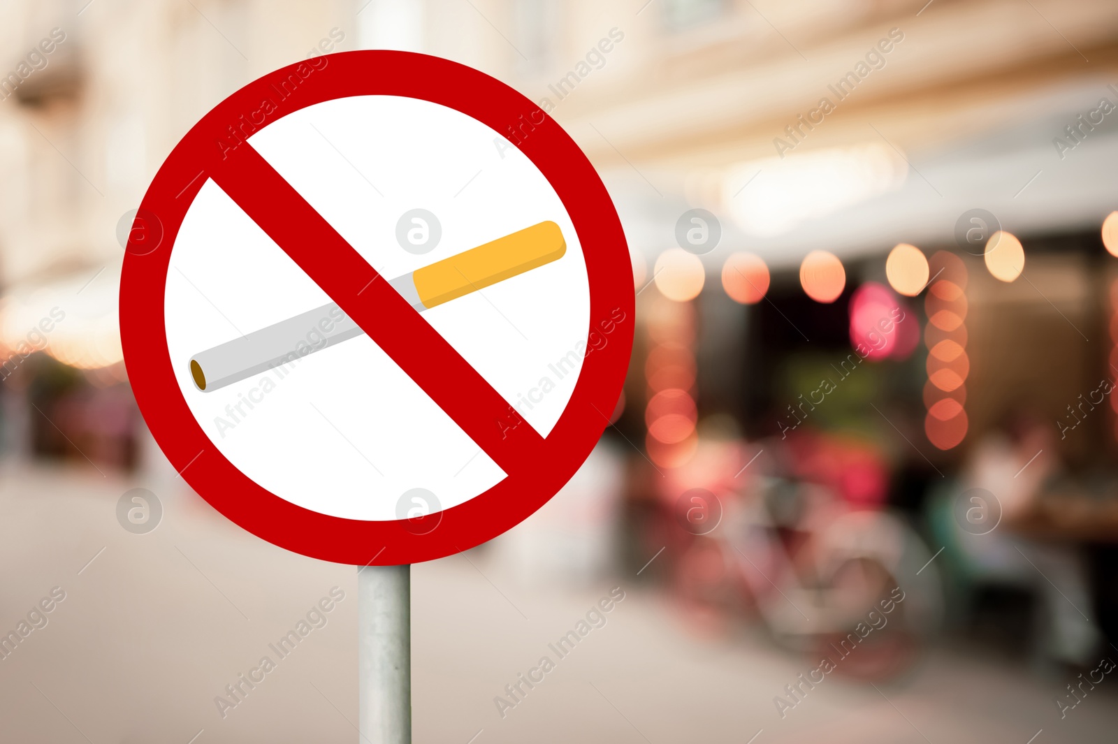 No Smoking sign on city street. Space for text Image of No Smoking sign on city street. Space for text
