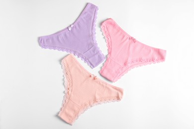 Photo of Women's underwear. Beautiful panties on white background, flat lay