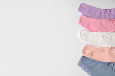 Photo of Women's underwear. Beautiful panties on white background, flat lay. Space for text