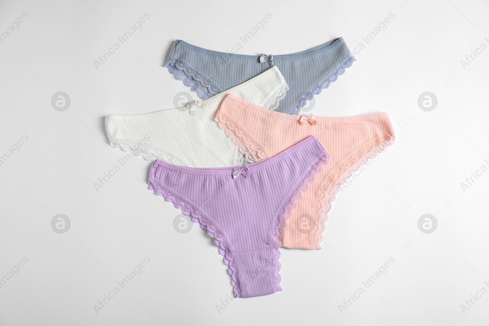 Women's underwear. Beautiful panties on white background, flat lay Photo of Women's underwear. Beautiful panties on white background, flat lay