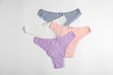 Photo of Women's underwear. Beautiful panties on white background, flat lay