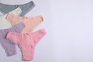Photo of Women's underwear. Beautiful panties on white background, flat lay. Space for text