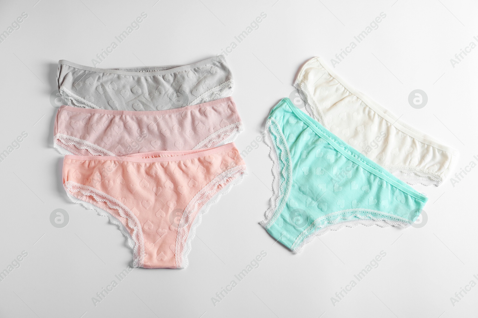 Women's underwear. Beautiful panties on white background, flat lay Photo of Women's underwear. Beautiful panties on white background, flat lay