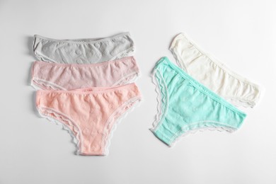 Photo of Women's underwear. Beautiful panties on white background, flat lay