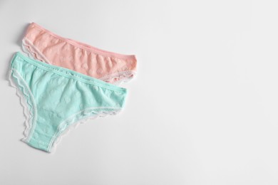 Photo of Women's underwear. Beautiful panties on white background, flat lay. Space for text