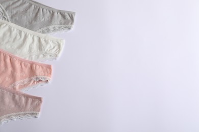 Photo of Women's underwear. Beautiful panties on white background, flat lay. Space for text