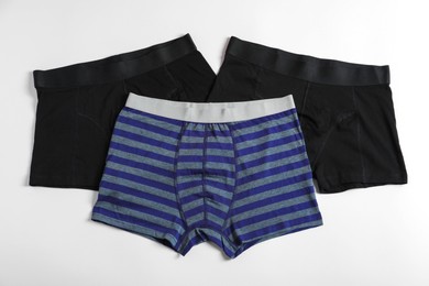 Photo of Comfortable men's underwear on white background, flat lay