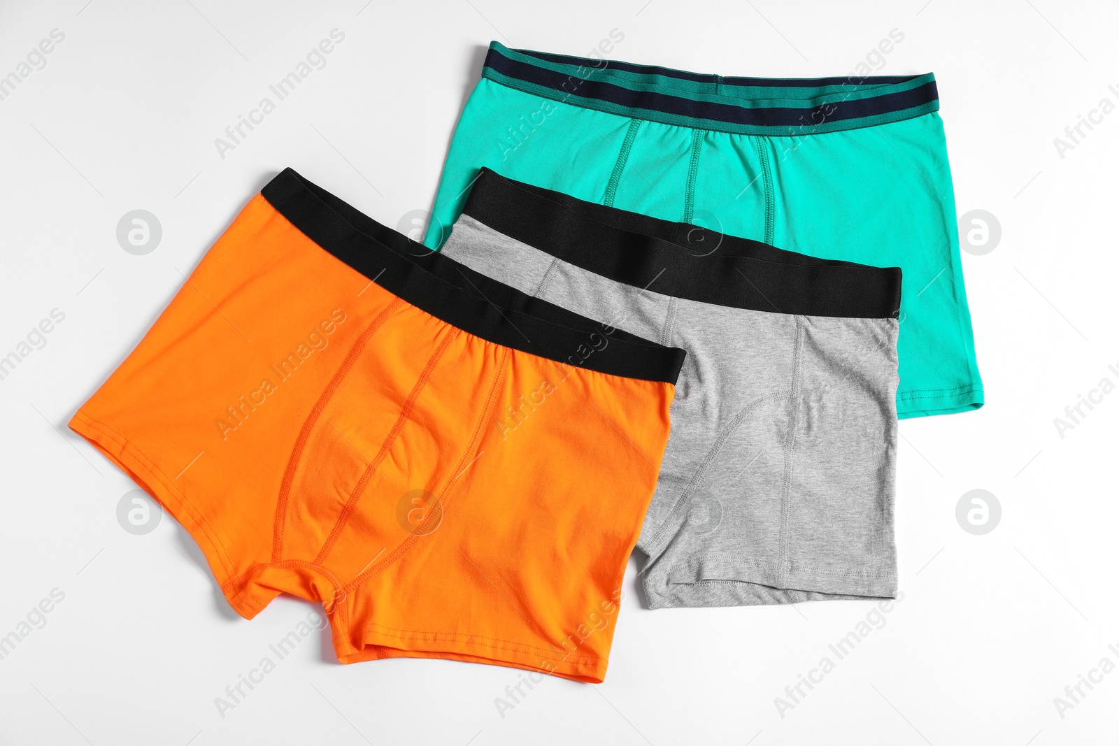 Comfortable men's underwear on white background, flat lay Photo of Comfortable men's underwear on white background, flat lay