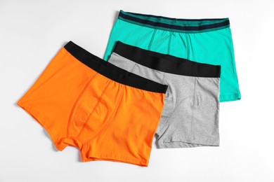 Photo of Comfortable men's underwear on white background, flat lay