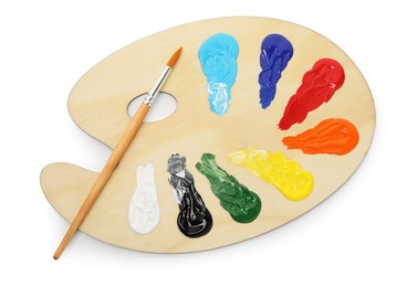 Photo of Wooden palette with paints and brush isolated on white, top view