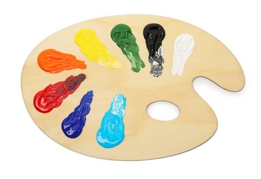 Photo of Wooden palette with paints isolated on white, top view
