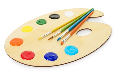 Photo of Wooden palette with paints and brushes isolated on white