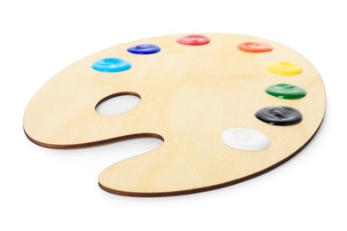 Photo of Wooden palette with paints isolated on white