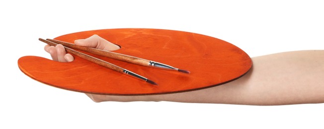 Photo of Artist with empty palette and brushes on white background, closeup