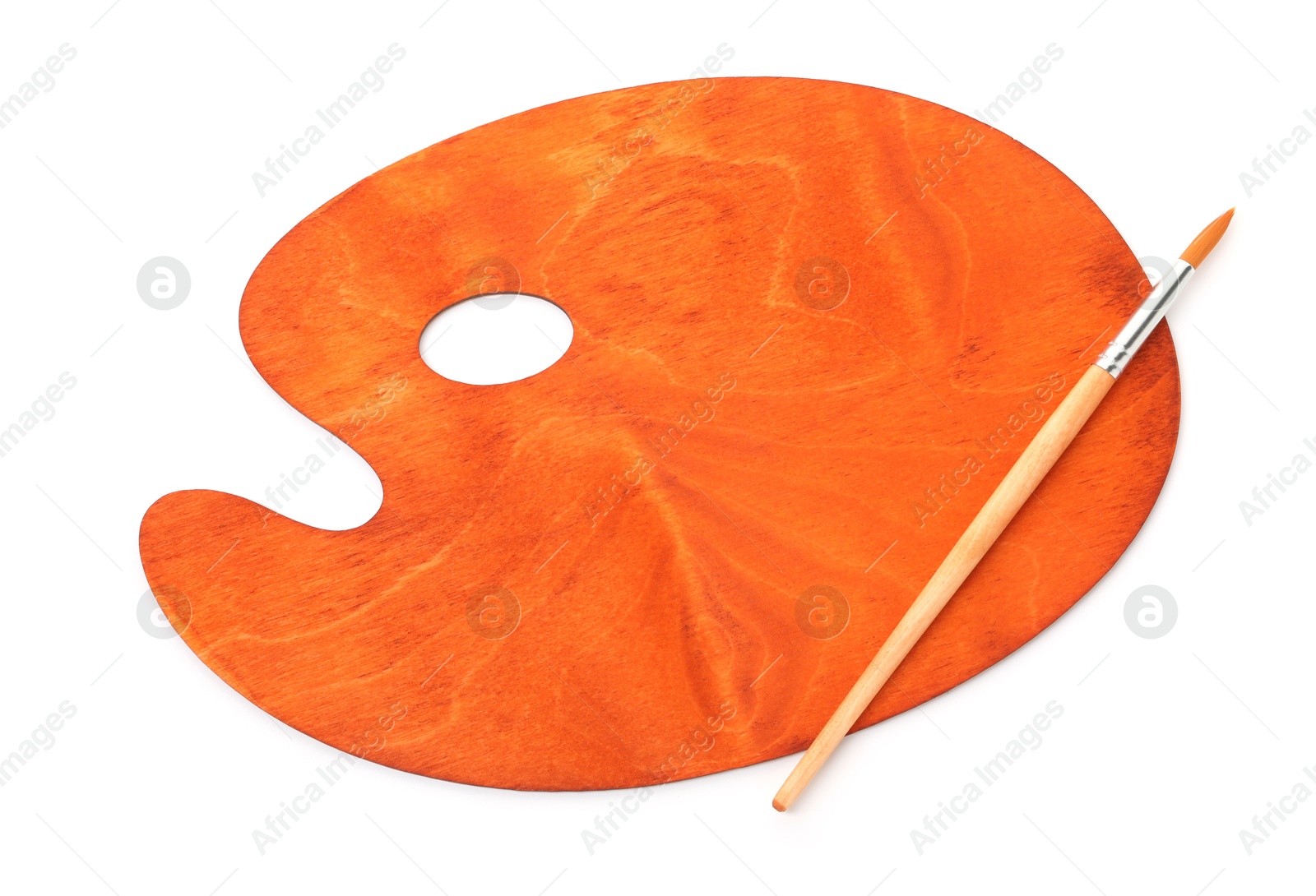 Photo of Wooden palette and brush isolated on white, top view