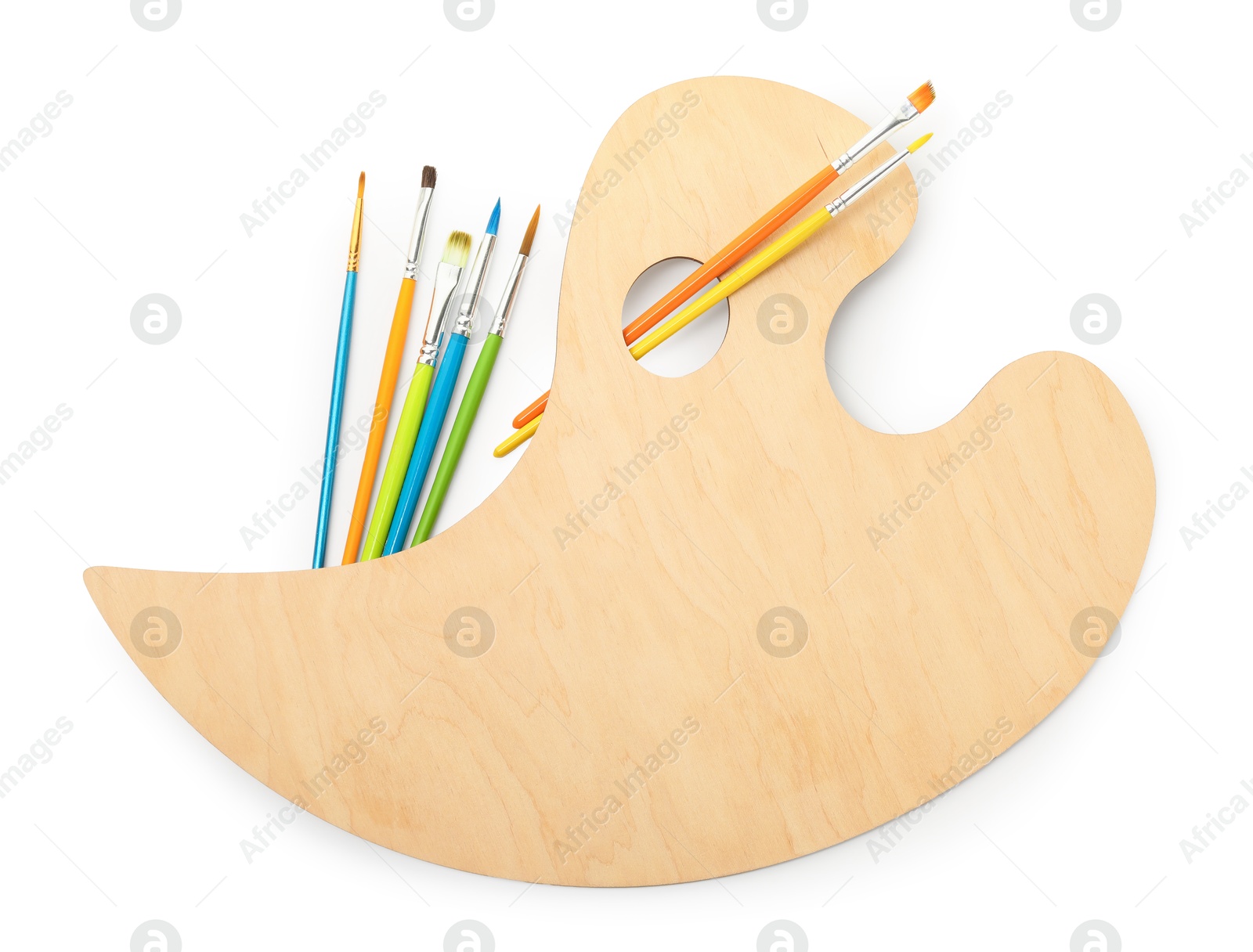 Photo of Wooden palette and brushes isolated on white, top view