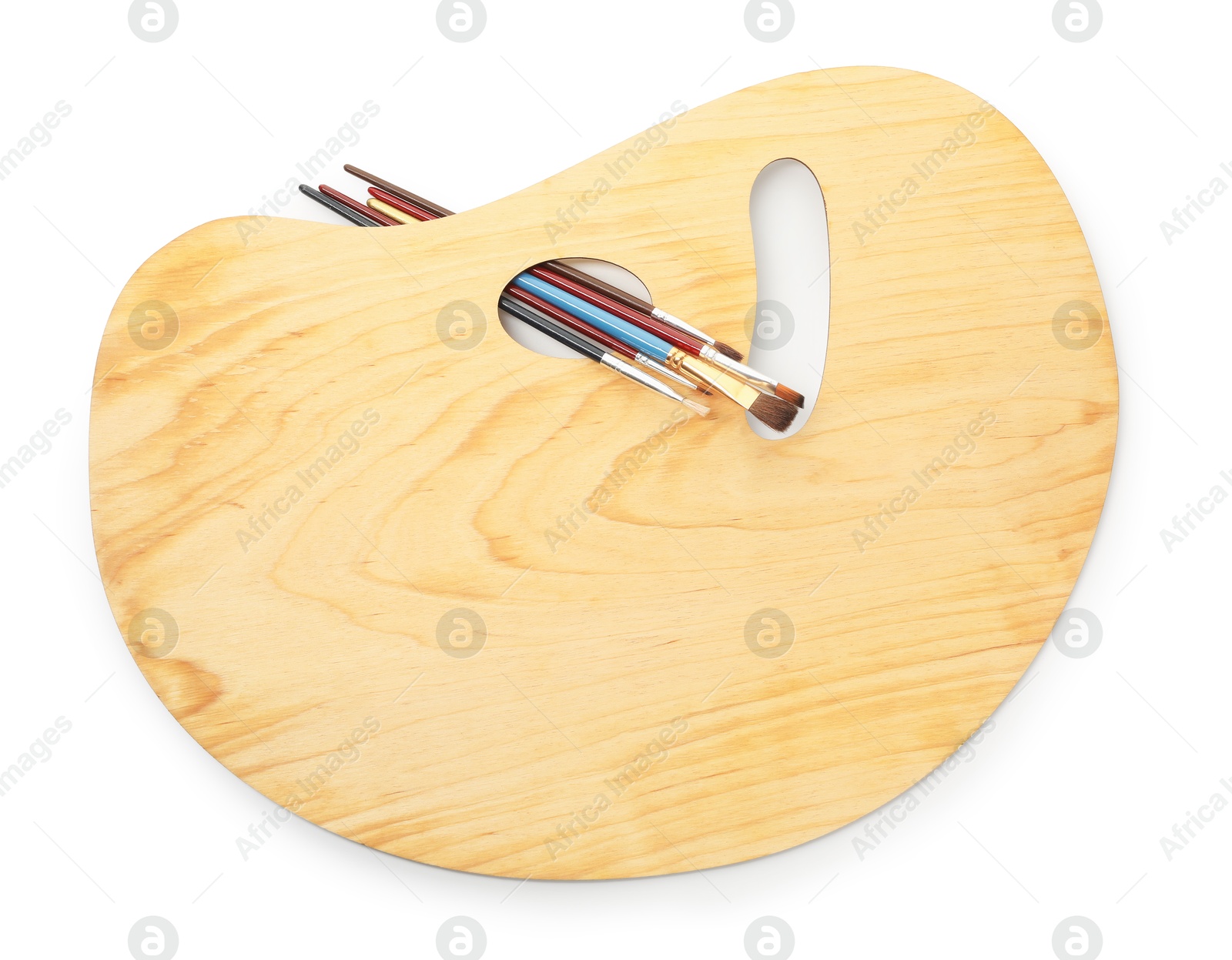 Photo of Wooden palette and brushes isolated on white, top view