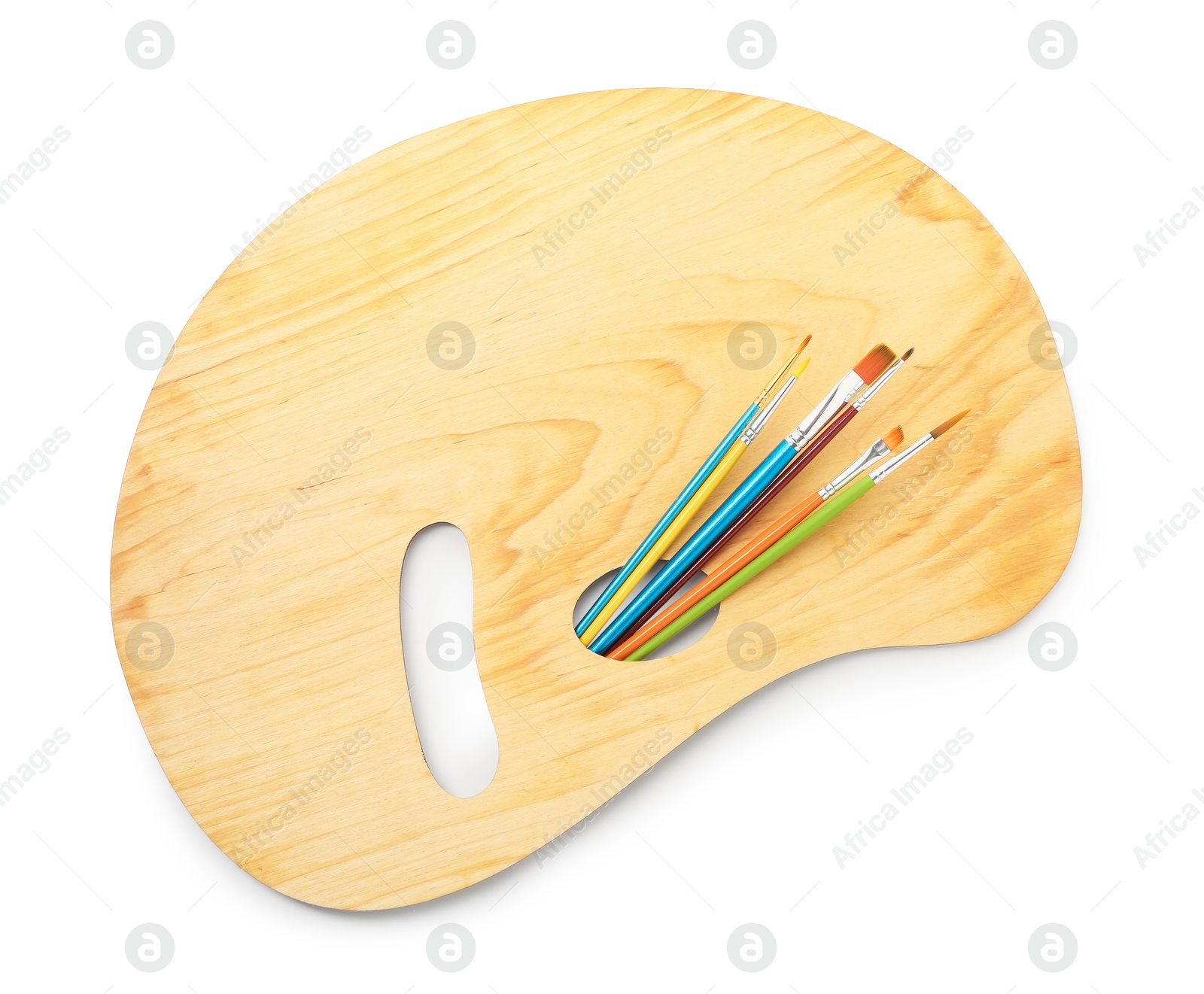 Photo of Wooden palette and brushes isolated on white, top view
