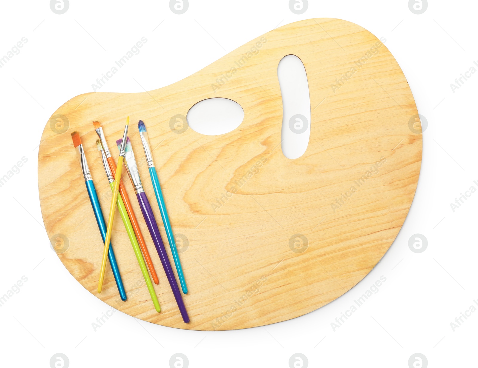 Photo of Wooden palette and brushes isolated on white, top view