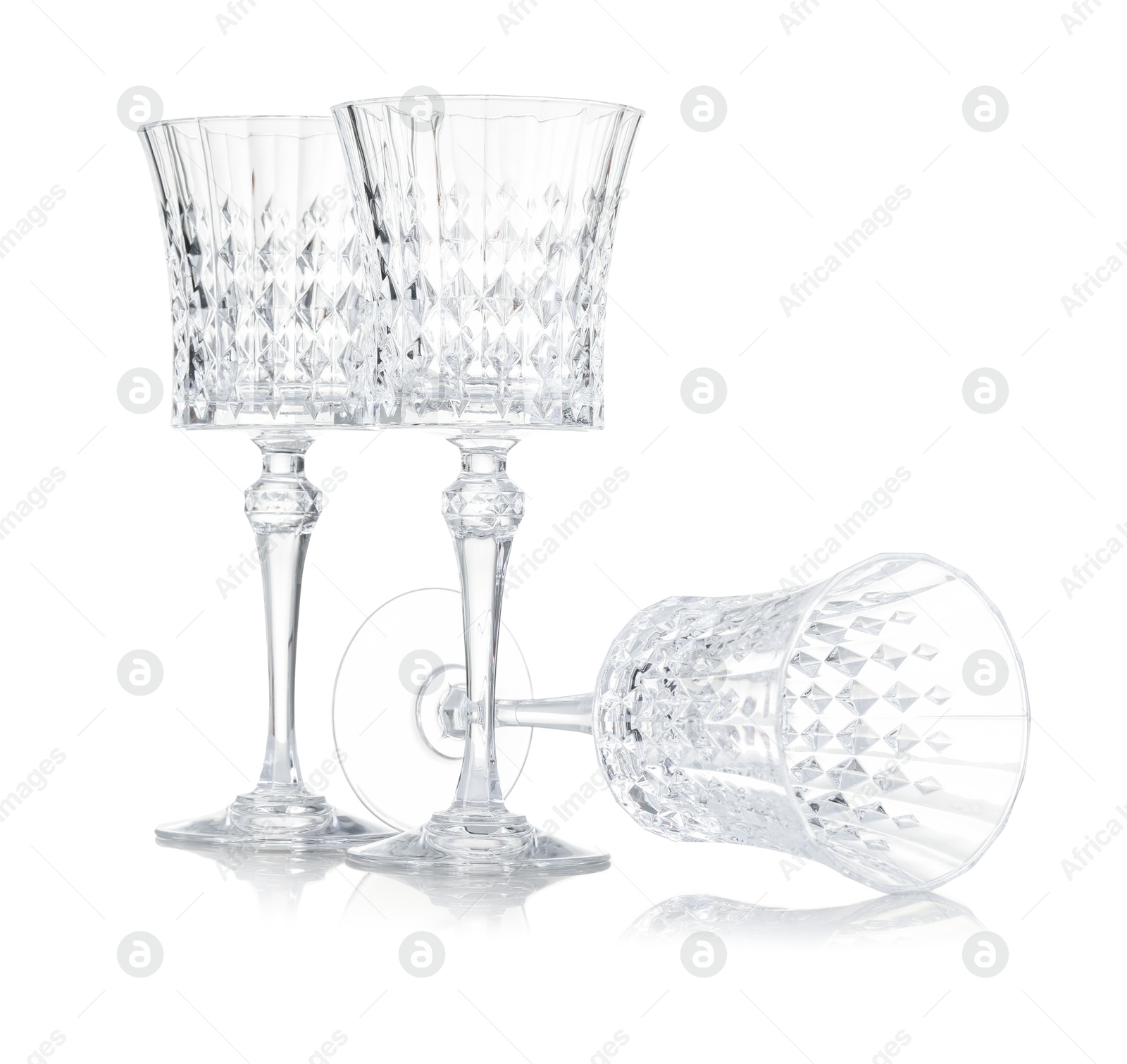 Photo of Three empty clean glasses isolated on white
