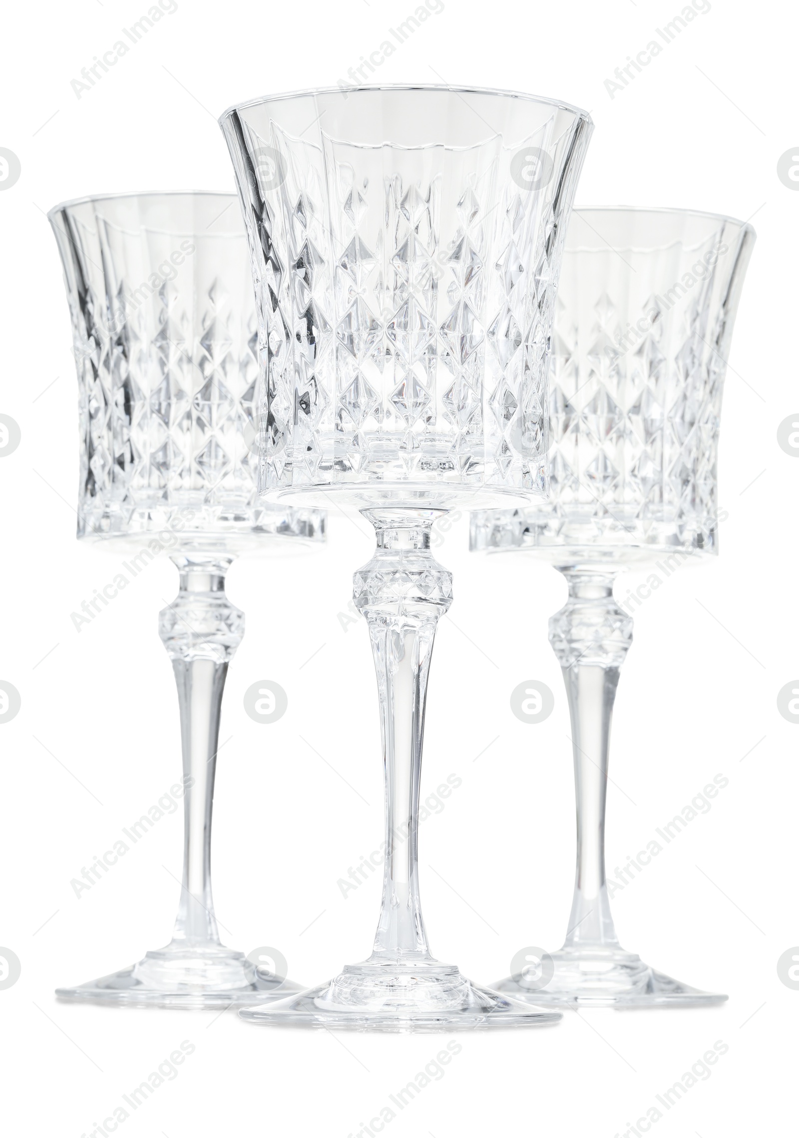 Photo of Three empty clean glasses isolated on white