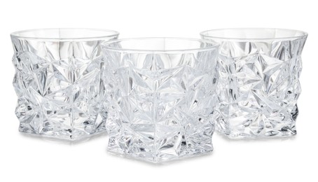 Photo of Three empty clean glasses isolated on white